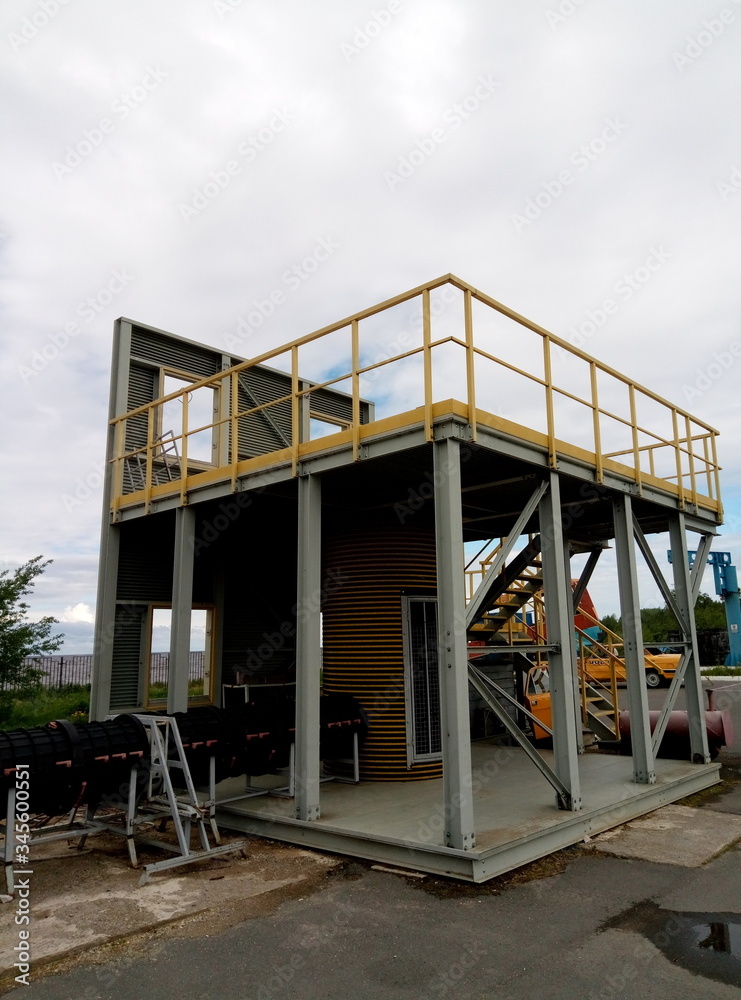 high platform with metal stairs