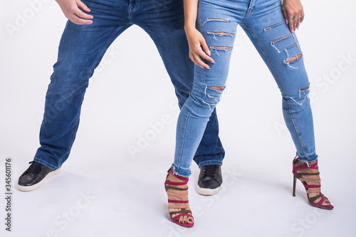 Close-up of couple dancing social dance. Kizomba or bachata or semba or taraxia , on white background. Social dance concept. photo