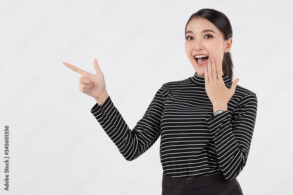 Beautiful young asian business woman in smart casual wear having showing empty hand and smile isolated on white background. Proposing product, advertisement, emotions, gestures. With copy space Beautiful young asian business woman in smart casual wear having showing empty hand and smile isolated on white background. Proposing product, advertisement, emotions, gestures. With copy space