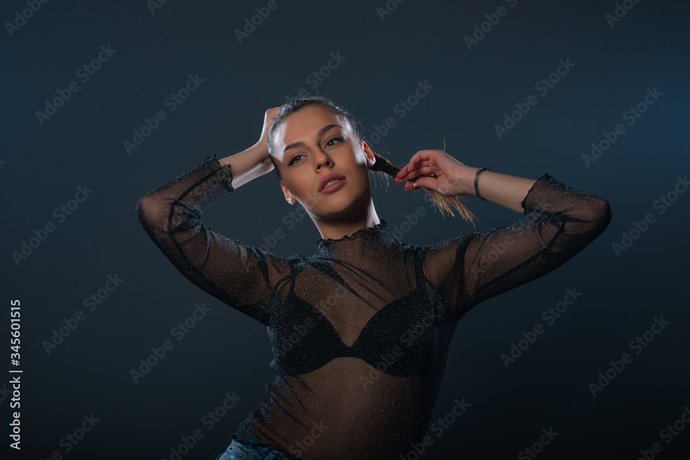 custom made wallpaper toronto digitalFashion portrait of an attractive brunette girl holding and pulling her ponytail.