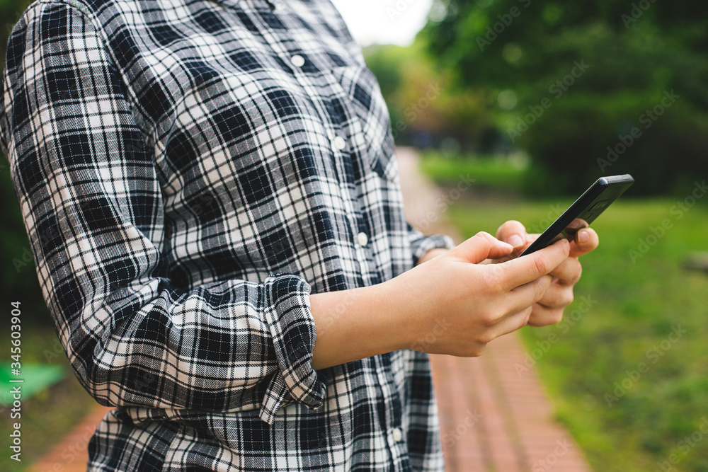 Young hipster woman using smart phone Young hipster woman using smart phone