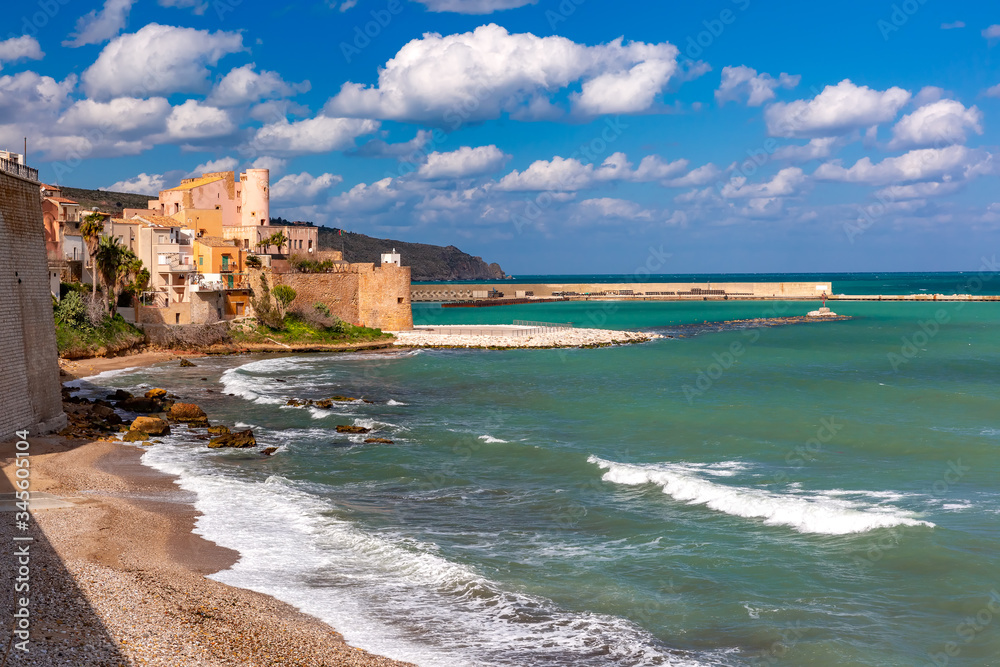 Sunny medieval fortress in Cala Marina, harbor in coastal city Castellammare del Golfo and Cala Petrolo Beach, Sicily, Italy Sunny medieval fortress in Cala Marina, harbor in coastal city Castellammare del Golfo and Cala Petrolo Beach, Sicily, Italy