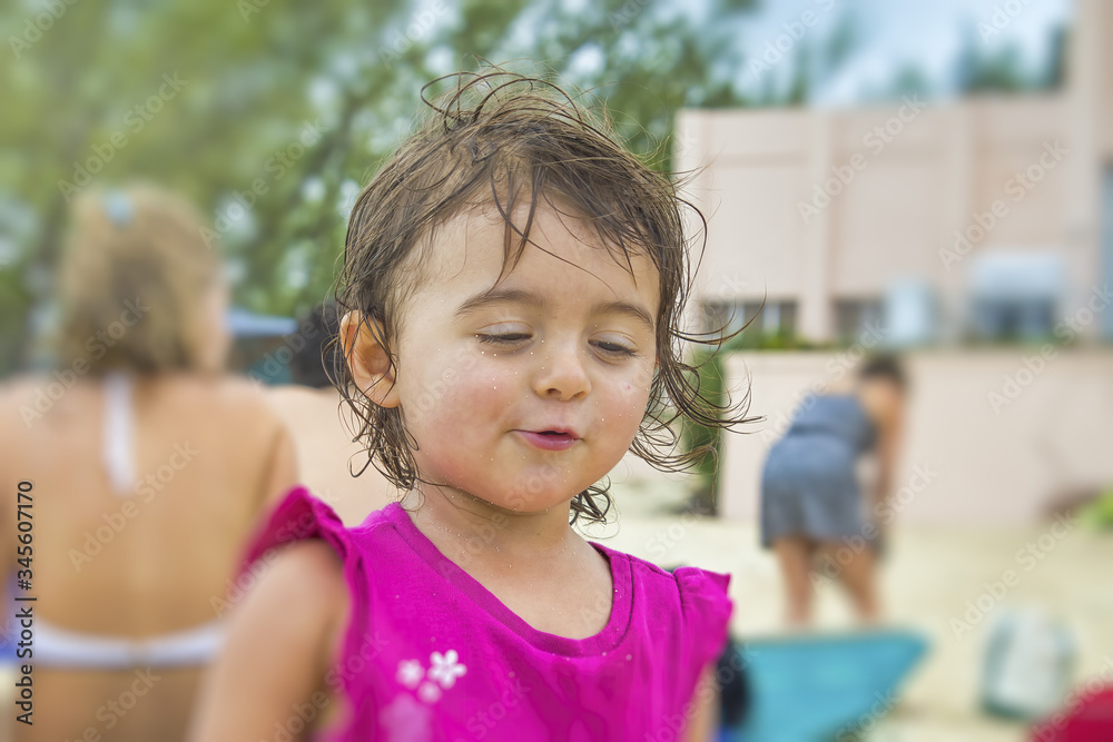 Happy cute young girl smiling and relaxing on the beach Happy cute young girl smiling and relaxing on the beach