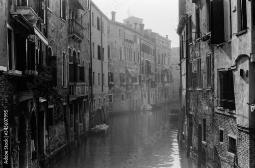 Empty Venice canal in winter fog