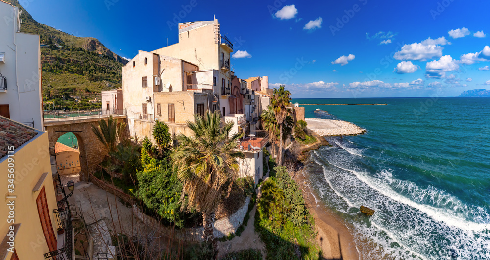 Sunny medieval fortress in Cala Marina, harbor in coastal city Castellammare del Golfo, Sicily, Italy