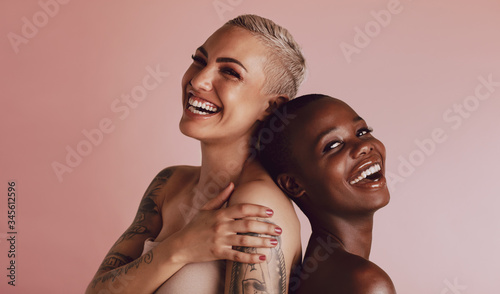 Beautiful women with buzz cut hairstyle smiling at camera