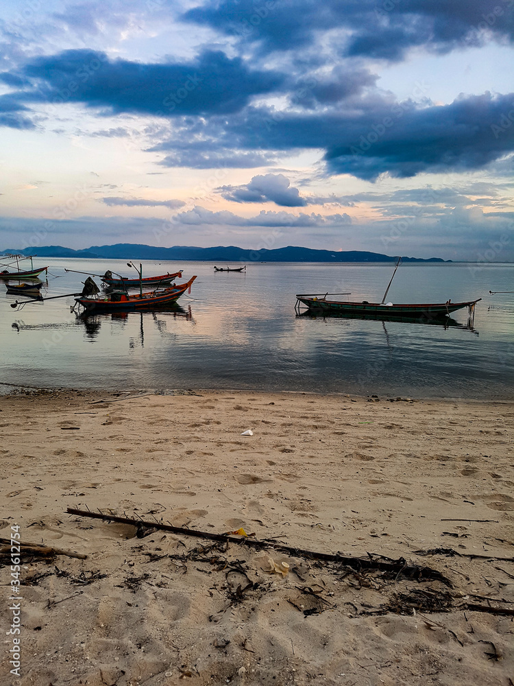 Warm orange light sunset sundown beach oceqan sea gulf thailand tropical asia isalnd clouds sky boat ship long tail tao Warm orange light sunset sundown beach oceqan sea gulf thailand tropical asia isalnd clouds sky boat ship long tail tao