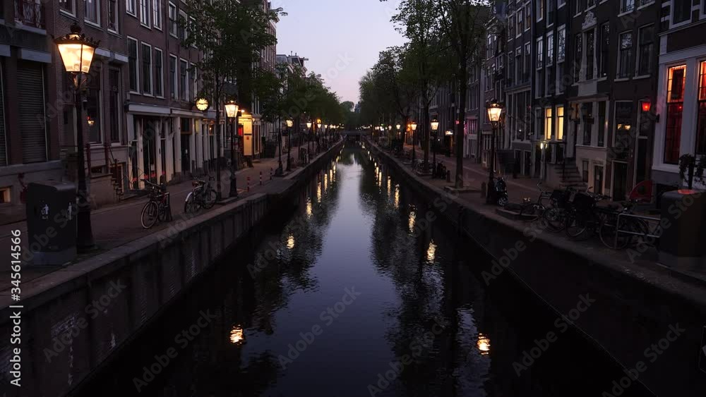 Amsterdam, Netherlands, April 2020. Quiet Red Light District at dusk, all activities shut down due to corona virus. Amsterdam, Netherlands, April 2020. Quiet Red Light District at dusk, all activities shut down due to corona virus.