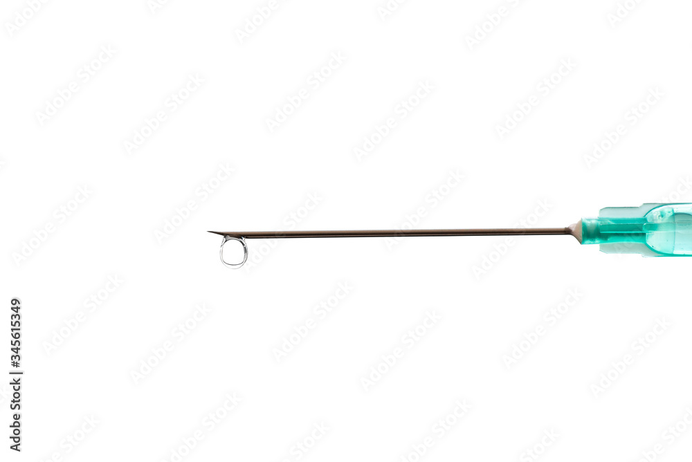 Medical syringe with a needle at the end of the drop. Medical syringe with a needle at the end of the drop.
