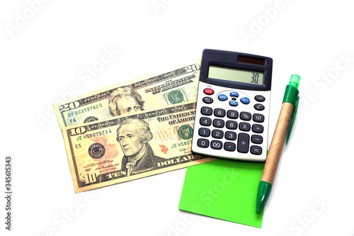 American dollars, pen, note paper and calculator on white background.