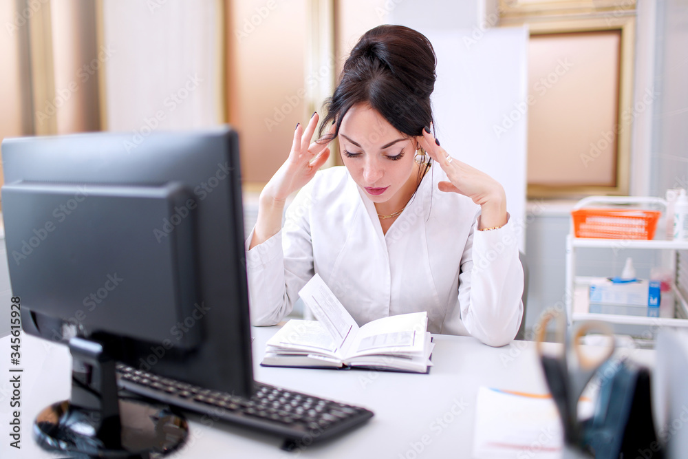 young doctor woman at medical office with hand on the head thinking about question, pensive expression. Doubt concept. young doctor woman at medical office with hand on the head thinking about question, pensive expression. Doubt concept.