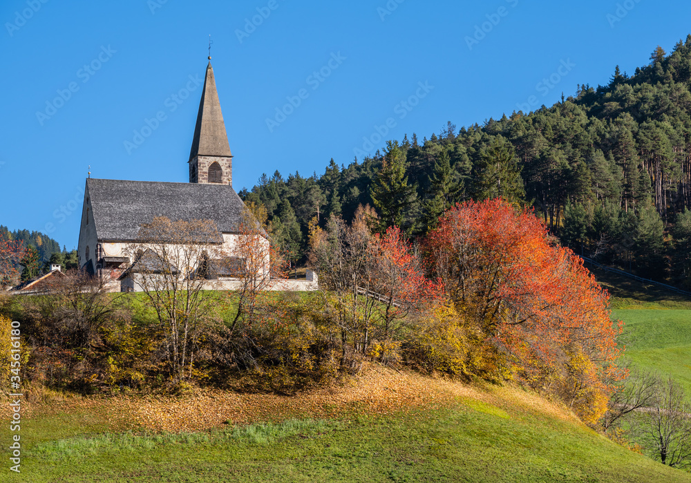 Autumn morning Santa Magdalena famous Italy Dolomites mountain village church