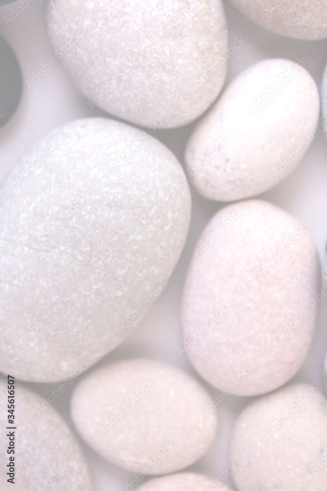 Blurred stone background. Warm stone massage. Close-up. Blurred stone background. Warm stone massage. Close-up.