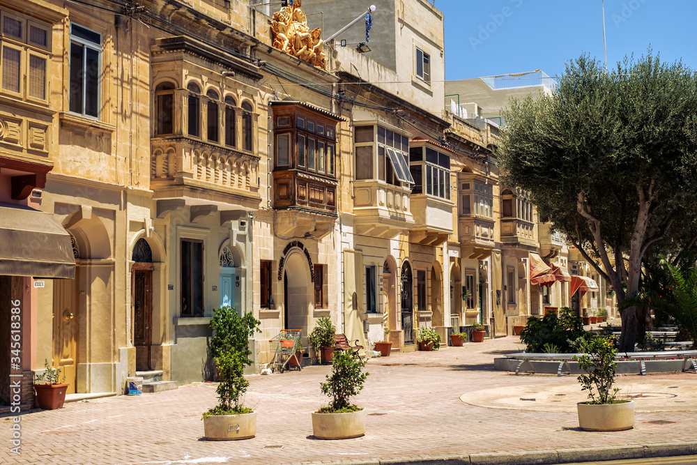 Traditional Maltese architecture in Albert city in Malta, street with traditional balconies and old buildings in historical city of Malta.