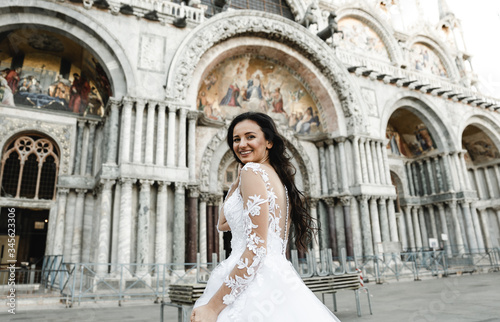 bride in motion,running bride,beautiful bride in a wedding dress walks in the old city,happy bride after the ceremony,bride at the wedding day © Vadym