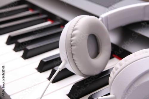 Headphones on piano keyboard