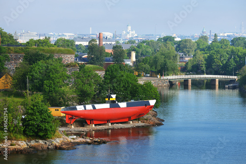 Red finnish submarine Vesikko near Suomenlinna fortress, close-up. Travel destinations, sightseeing theme. Summer landscape. Helsinki, Finland photo