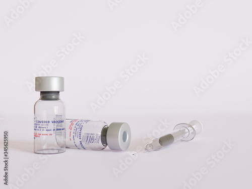 Vaccine Vials for Codiv-19 or Coronavirus with a syringe in studio set with plain white minimalist background
