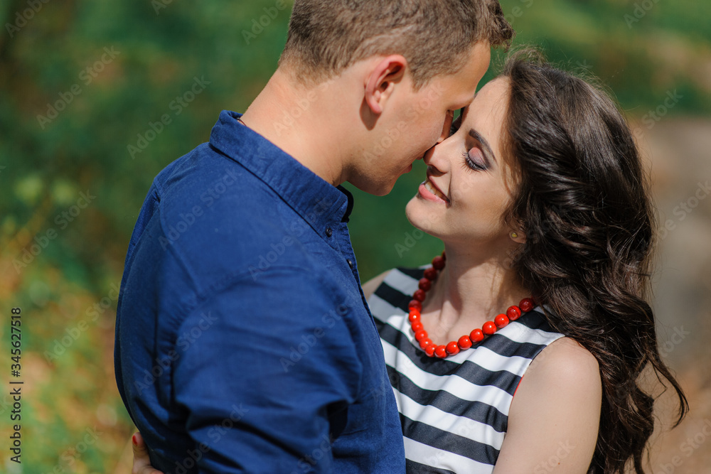 Young beautiful couple in love in the forest. Frame shot close up. Shot a moment before the kiss. Free space. Young beautiful couple in love in the forest. Frame shot close up. Shot a moment before the kiss. Free space.