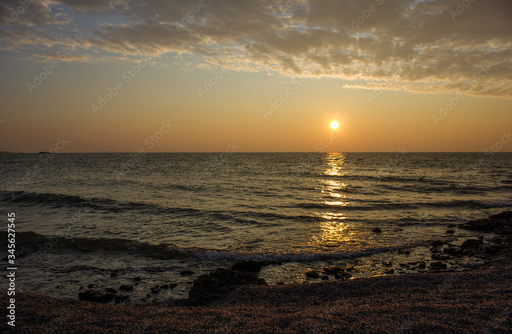 Golden sunset on the seashore.