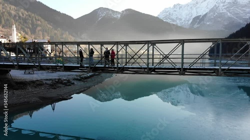 Circular pan around bridge with misty background and mountains