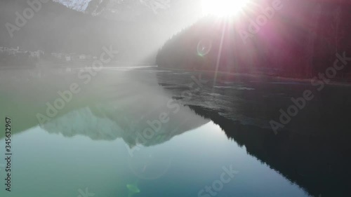 Pan forward on misty blue lake 