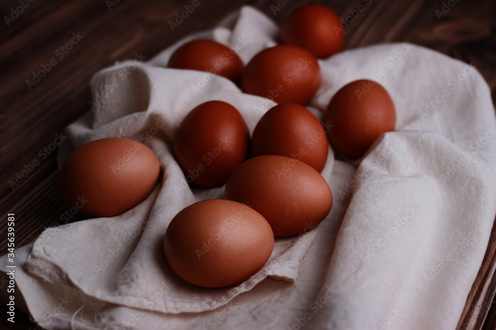chicken eggs on a white fabric with drapery chicken eggs on a white fabric with drapery
