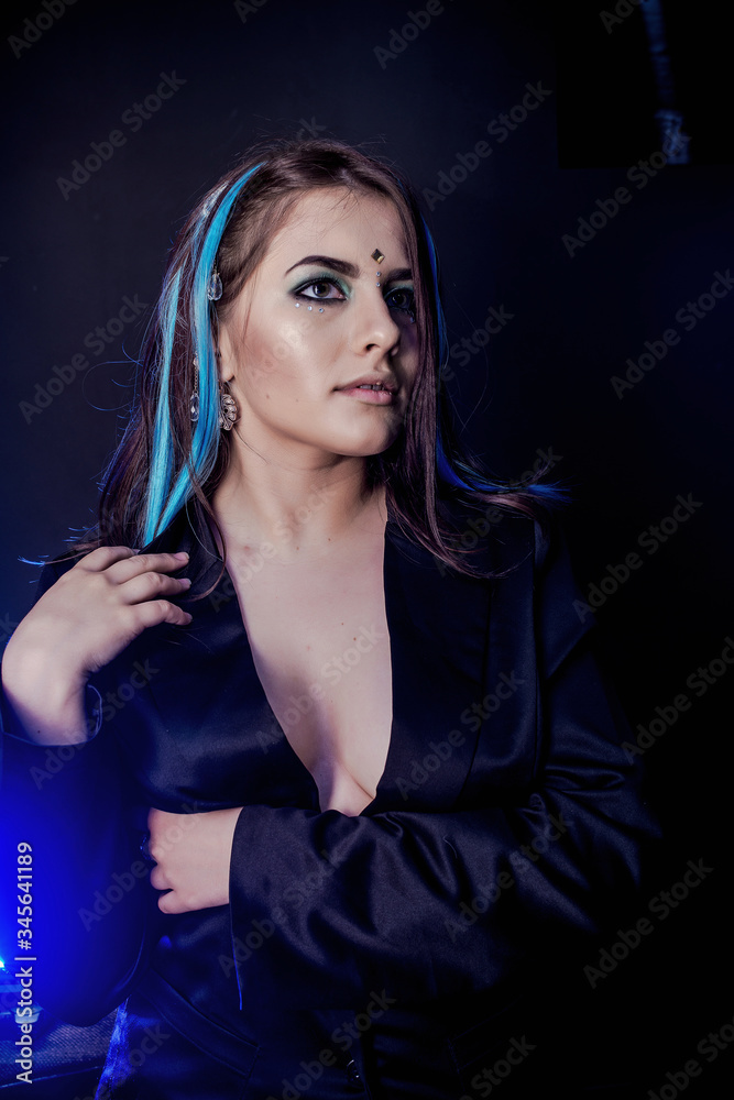 modern angel on a black background with blue light modern angel on a black background with blue light