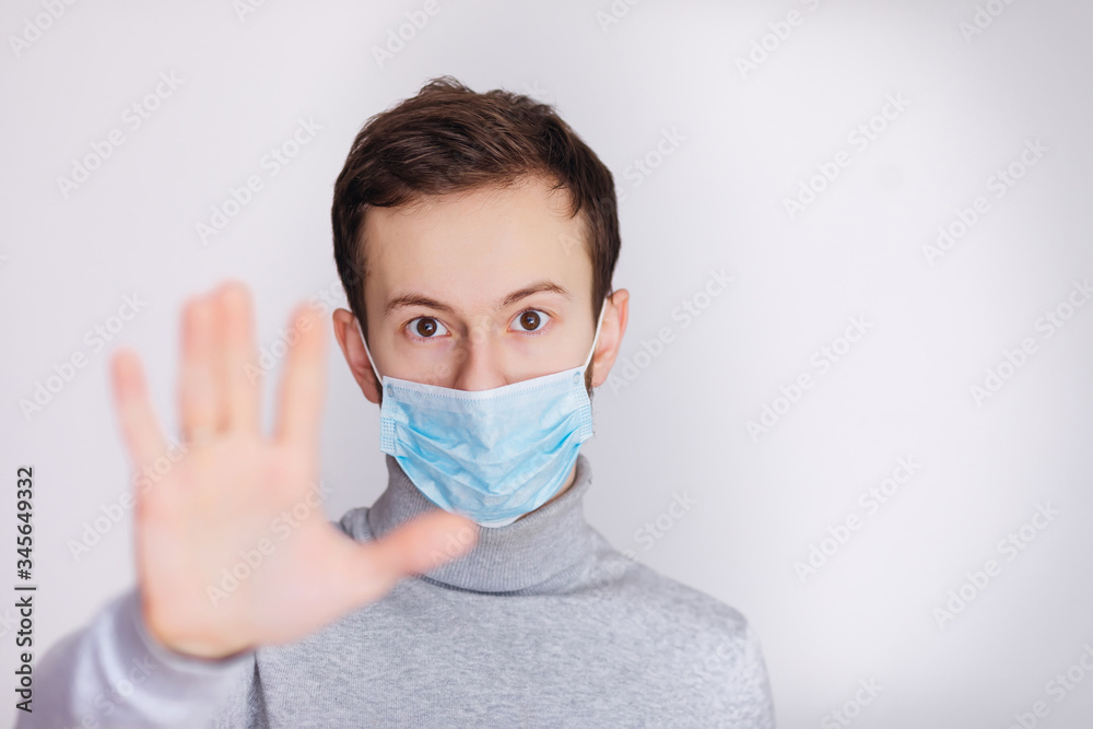 Stop the infection! Healthy man showing gesture Stop the infection! Healthy man showing gesture