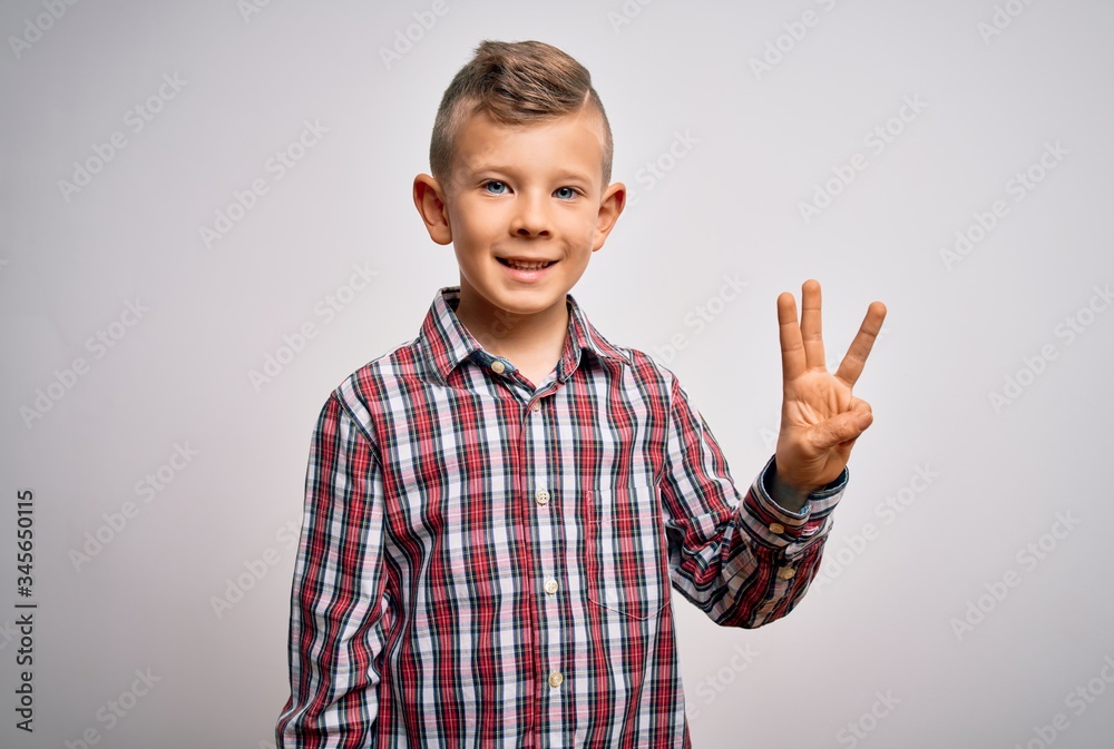 Young little caucasian kid with blue eyes wearing elegant shirt standing over isolated background showing and pointing up with fingers number three while smiling confident and happy. Young little caucasian kid with blue eyes wearing elegant shirt standing over isolated background showing and pointing up with fingers number three while smiling confident and happy.