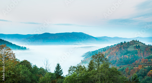 Fototapeta Naklejka Na Ścianę i Meble -  Beautiful morning landscape with autumn foggy mountains.