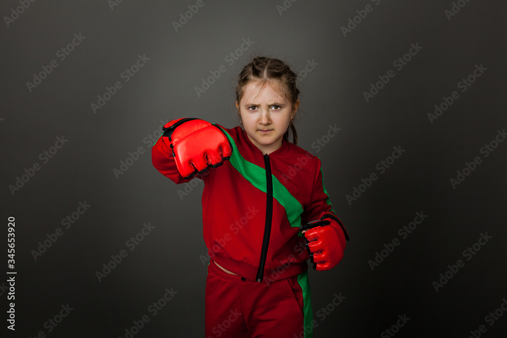 Beautiful little girl boxer in gloves ready to fight. Beautiful little girl boxer in gloves ready to fight.