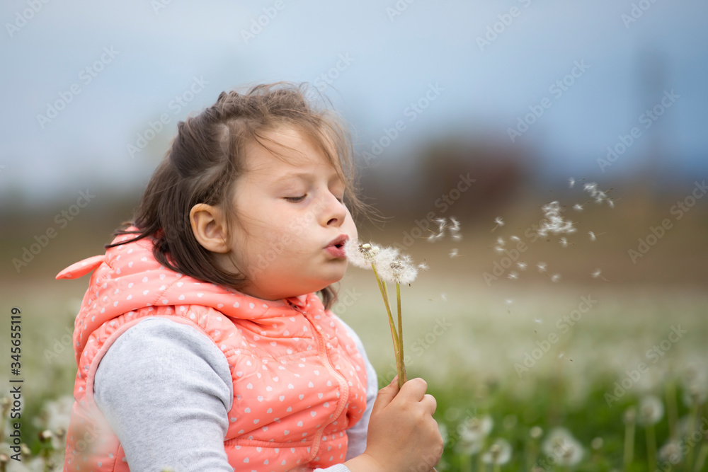 Cute little girl on the meadow in spring day Cute little girl on the meadow in spring day