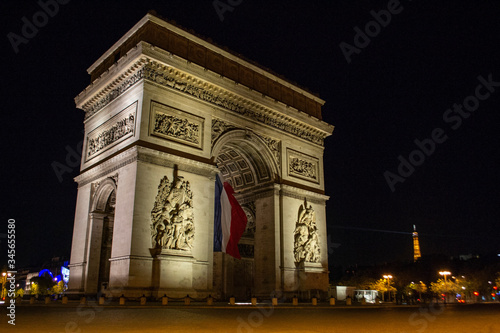 Arc de Triomphe of Paris on Charles de Gaulle Square at night © Olena