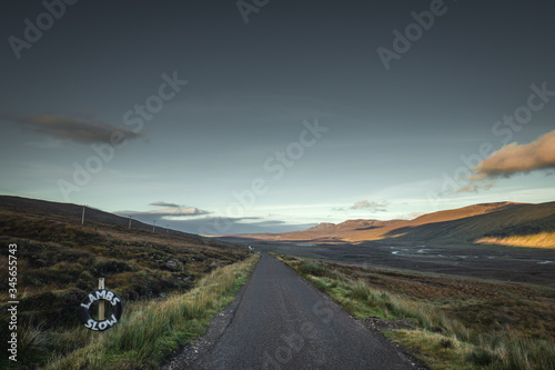 Rural Road Across Scottish Highlands at Sunset © Eddie Cloud