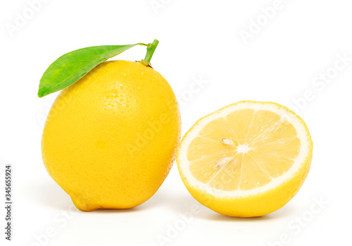 Lemon cut half with leaf isolated on white background with clipping path