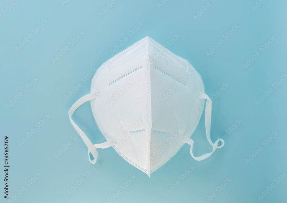 white medical mask in the form of a mask worn on the face. white medical mask in the form of a mask worn on the face.