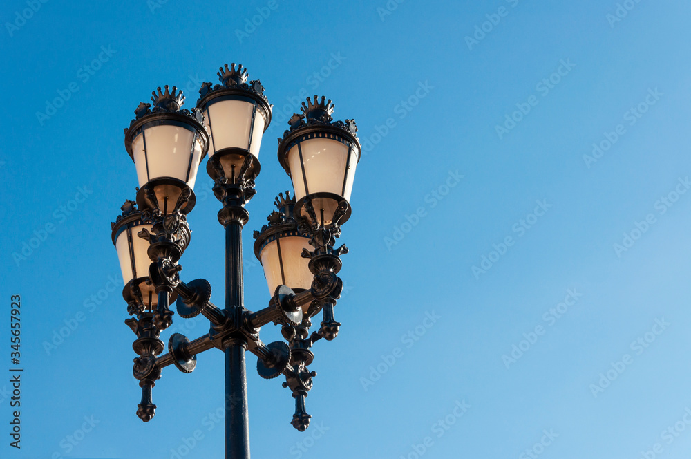 Five urban street lights at dawn