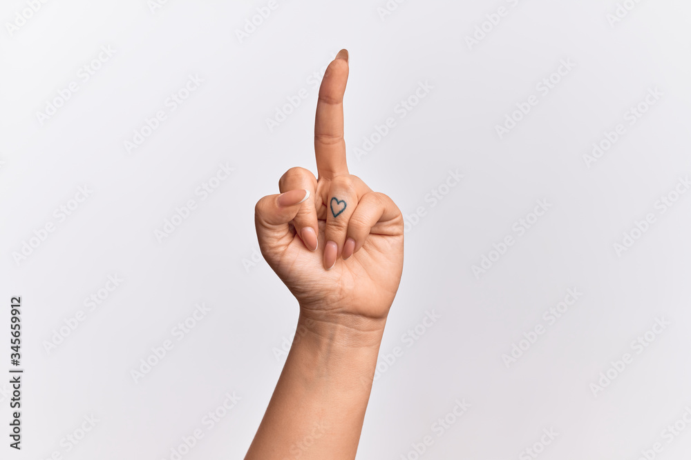 Hand of caucasian young woman showing provocative and rude gesture doing fuck you symbol with middle finger Hand of caucasian young woman showing provocative and rude gesture doing fuck you symbol with middle finger