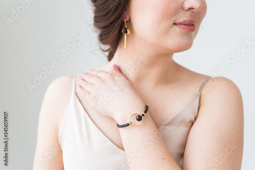 Close-up of beautiful woman wearing bracelet. Accessories, jewelry and bijouterie concept.