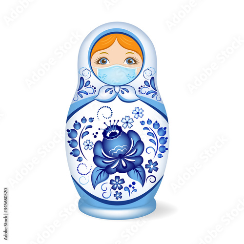 Russian wooden nesting doll wearing a face mask. Babushka or Matryoshka. Decorated with Gzhel, Russian traditional painted floral pattern. 