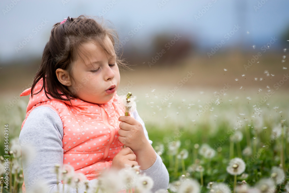 Cute little girl on the meadow in spring day Cute little girl on the meadow in spring day