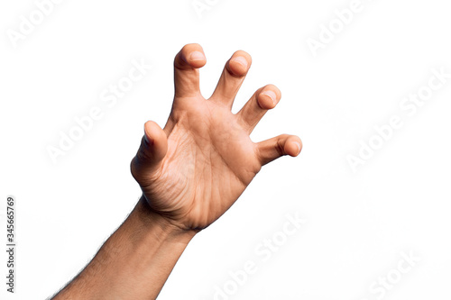 Obraz na plátně Hand of caucasian young man showing fingers over isolated white background grasp