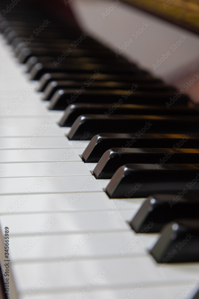 Close-up or macro image of piano keys by selective focus technique can be seen the details of classic instruments used in both Jazz and pop music which background and foreground are blurred. Close-up or macro image of piano keys by selective focus technique can be seen the details of classic instruments used in both Jazz and pop music which background and foreground are blurred.