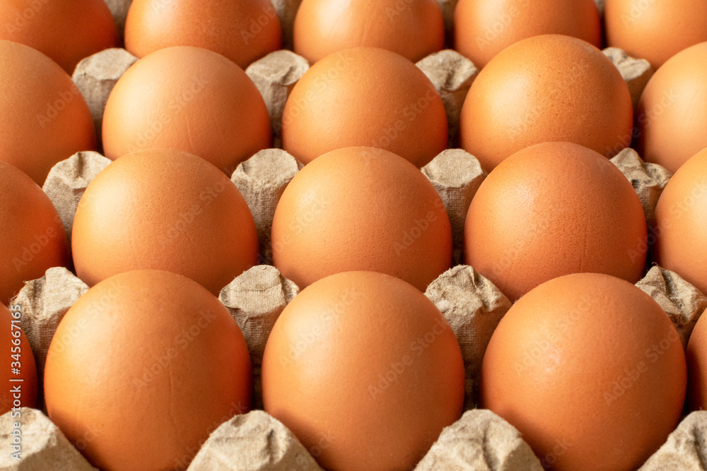 Brown egg in paper packaging. Container for eggs. Recycling. Healthy rustic breakfast Brown egg in paper packaging. Container for eggs. Recycling. Healthy rustic breakfast