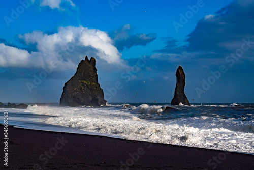 The cliffs by the township of Vik in Iceland Reynisdrangar basalt sea stacks