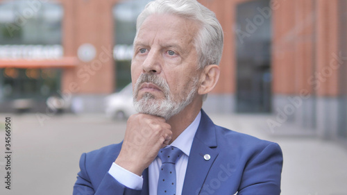 Outdoor Portrait of Old Businessman Thinking New Plan