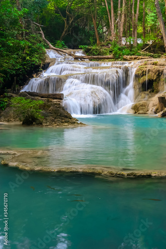 The beautiful Erawan cascade waterfall with turquoise water like heaven at the tropical forest ,Kanchanaburi Nation Park, Thailand © Anukool