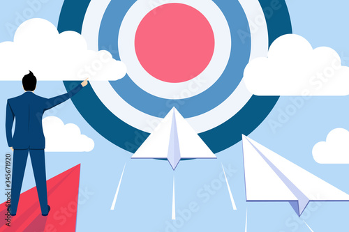 Businessman leader point finger to dartboard, Standing on red paper plane to command or supervising white paper plane  flying at the target, To goal to achieve success, business Concept.