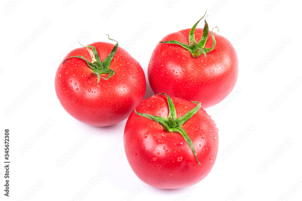 Red fresh tomatoes isolated on white background in close-up Red fresh tomatoes isolated on white background in close-up